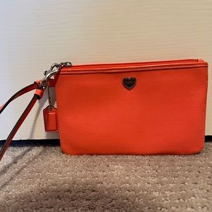 Orangeish Coach Wristlet